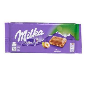 Ciocolata Milka cu lapte si bucati de alune 100g